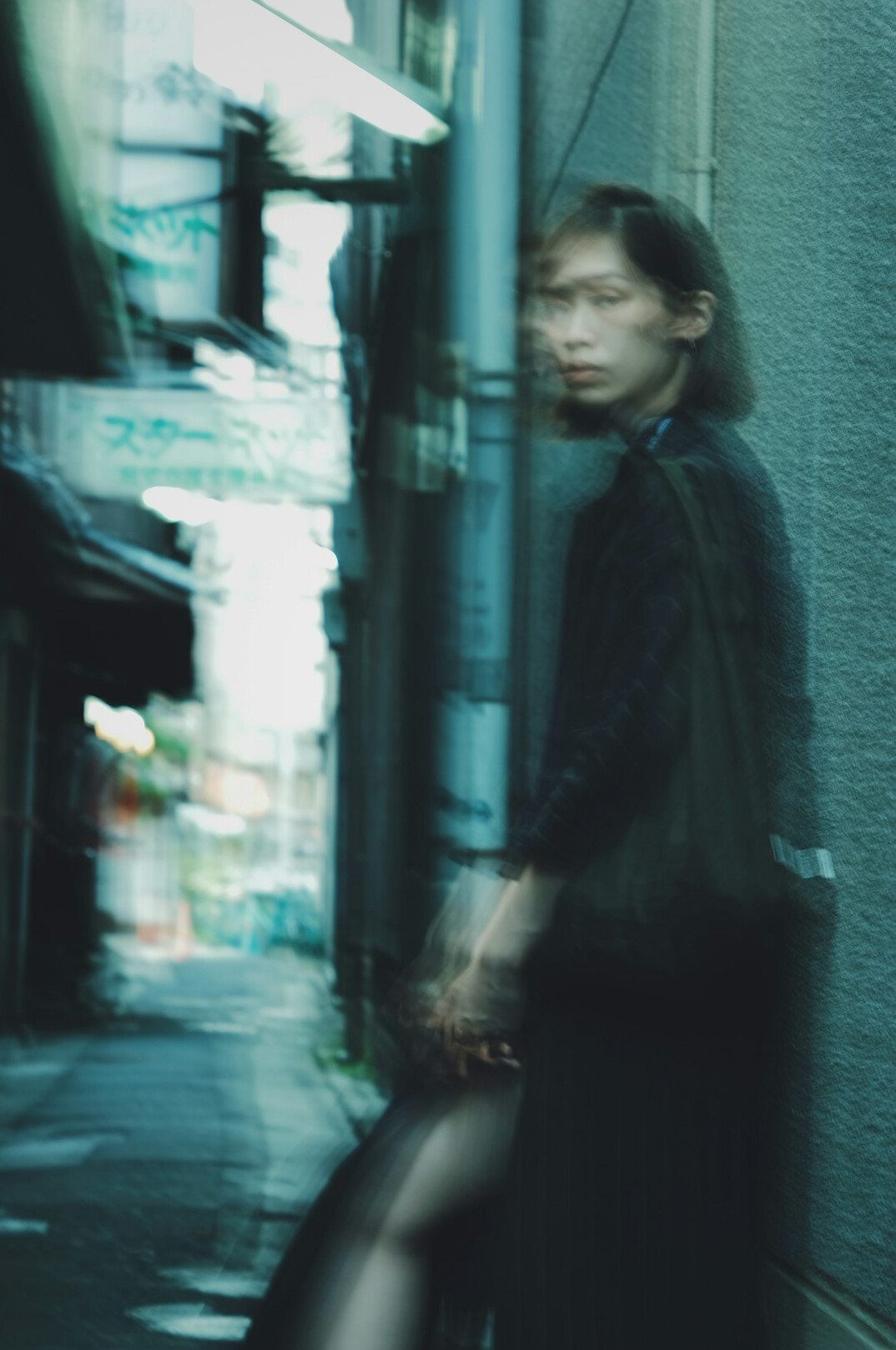 Studio portrait of a young Japanese woman in business casual clothing