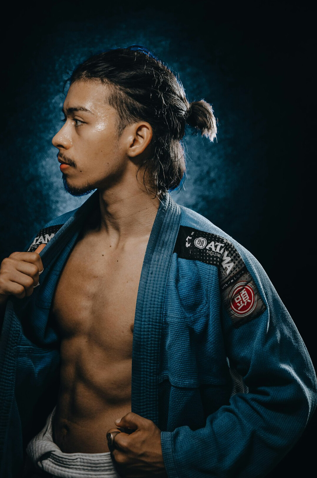 Studio portrait of a young Japanese man in smart casual clothing